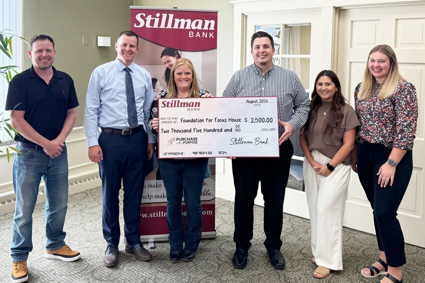 Foundation for Focus House: Stillman Bank Retail Office Manager Ryan Spradlin (center), Universal Banker Jasmin Galvan (second from right), and Teller Colleen Roberts present the $2,500 check to Foundation for Focus House Treasurer Lance Charnock (left), Foundation for Focus House Vice President Russell Crull (second from left) and Foundation for Focus House Executive Director Jeni Hardin (center).