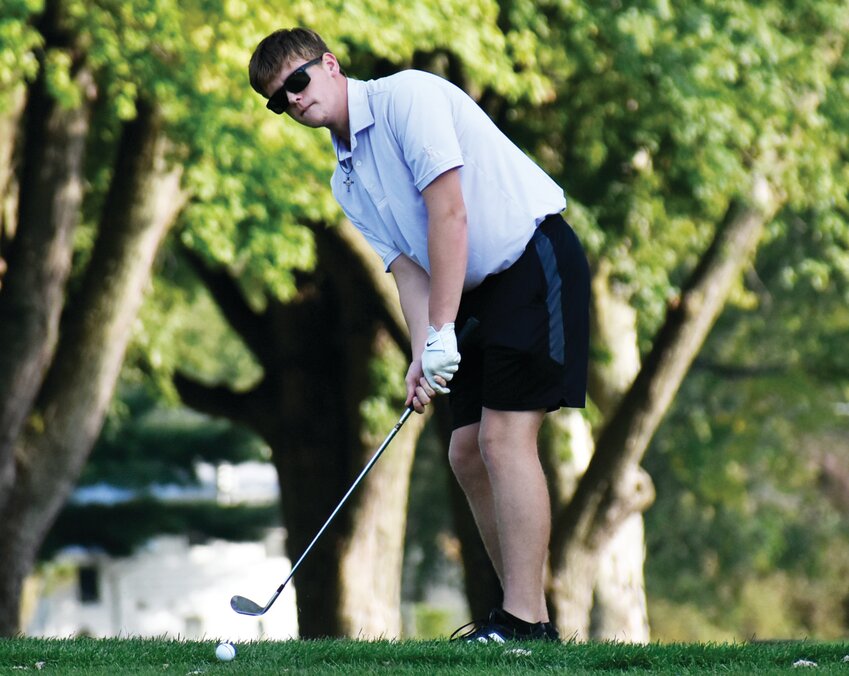 Senior Jacob Ost chips onto the ninth green during the Rochelle Hub golf match against Forreston on Thursday.