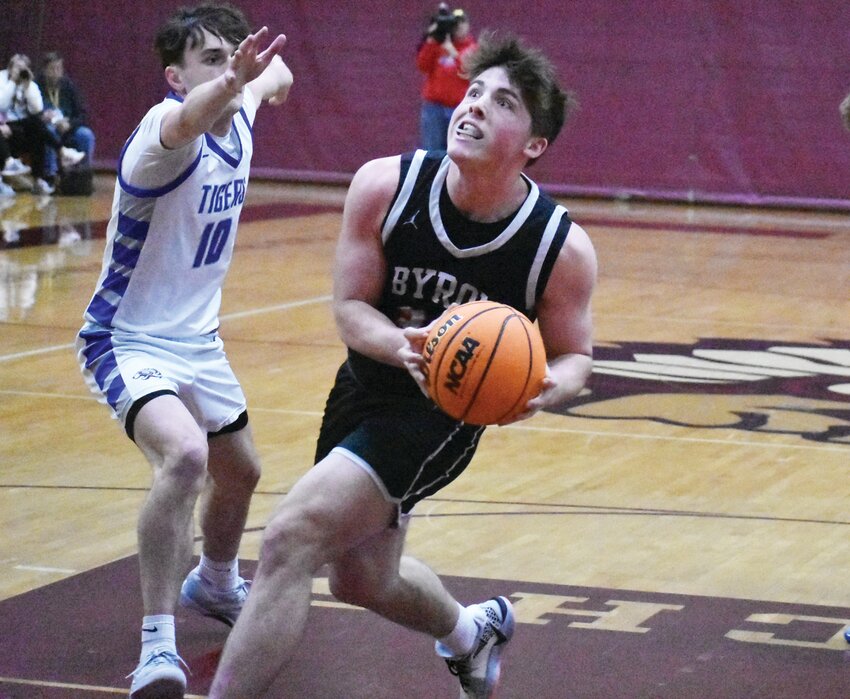 Byron's Caden Considine avoids the outstretched hand of defender Gavin Lanham during the IHSA 2A Sectional Semifinal against Princeton on Wednesday.