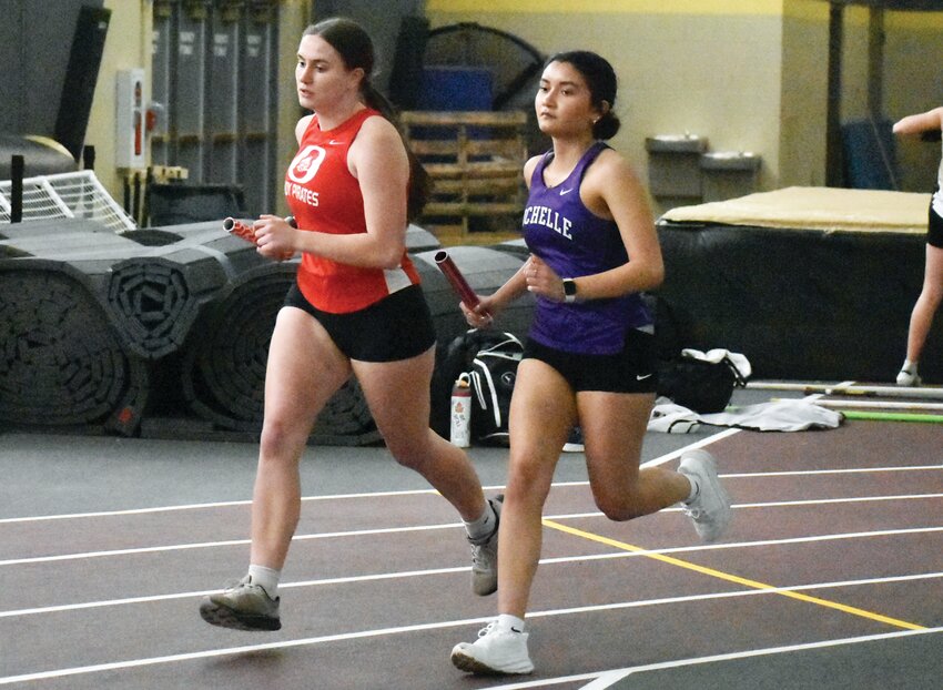 Senior Arline Villanueva runs her leg of the 3200-meter relay during the Sycamore Invitational on Tuesday.