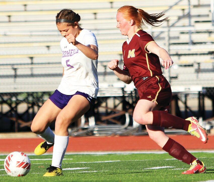 Freshman Abigail Dougherty kicks the ball during the Rochelle Lady Hub soccer match against Morris on Monday.