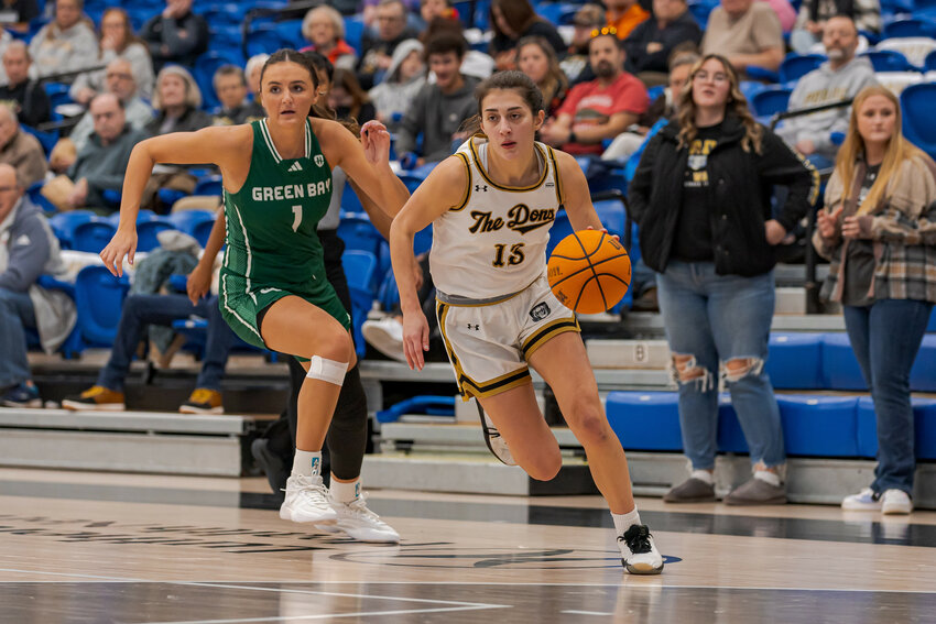 Mendota native and Purdue University Fort Wayne graduate student Amellia Bromenschenkel passes a Green Bay defender during the Horizon League Championship on March 11. The Mastodons didn’t win the league tournament, but they finished 27-9 and made it to the Women’s National Invitation Tournament Great 8 for the first time in program history.  (Photo contributed)