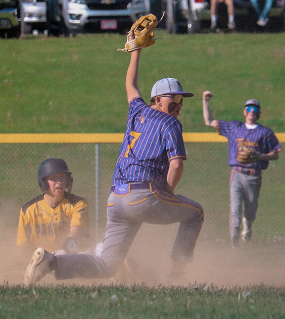 Mendota’s Collin Coss holds his glove up with hopes of getting an out call from the umpire during a game with Putnam County on May 9 at the MHS field. (Photo courtesy of Talia White, MHS)