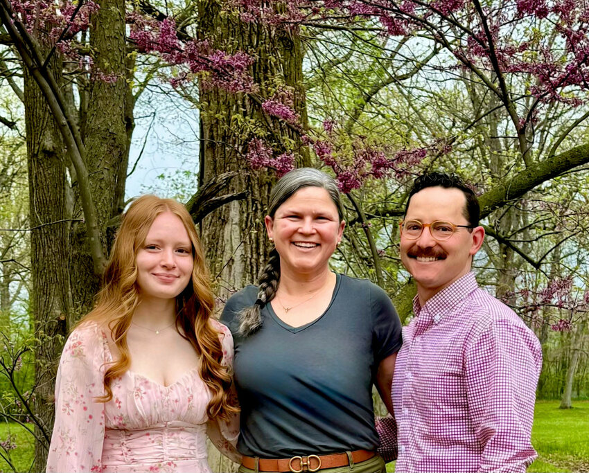 Grace Duke, left, CHS Class of 2025 and the inaugural John Warner, IV Memorial Scholar, is congratulated by Maureen Collins-Kolb and Jonah Kolb, of The Warner & Kolb Family Foundation.
