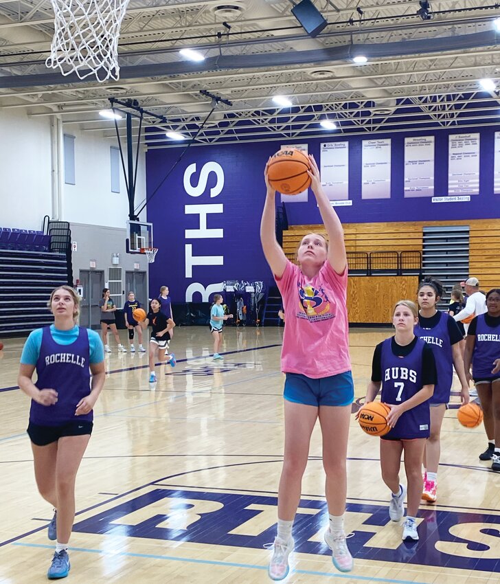 Junior Reese Kissack puts up a shot during the Rochelle Lady Hub basketball team's summer practice on Monday morning.
