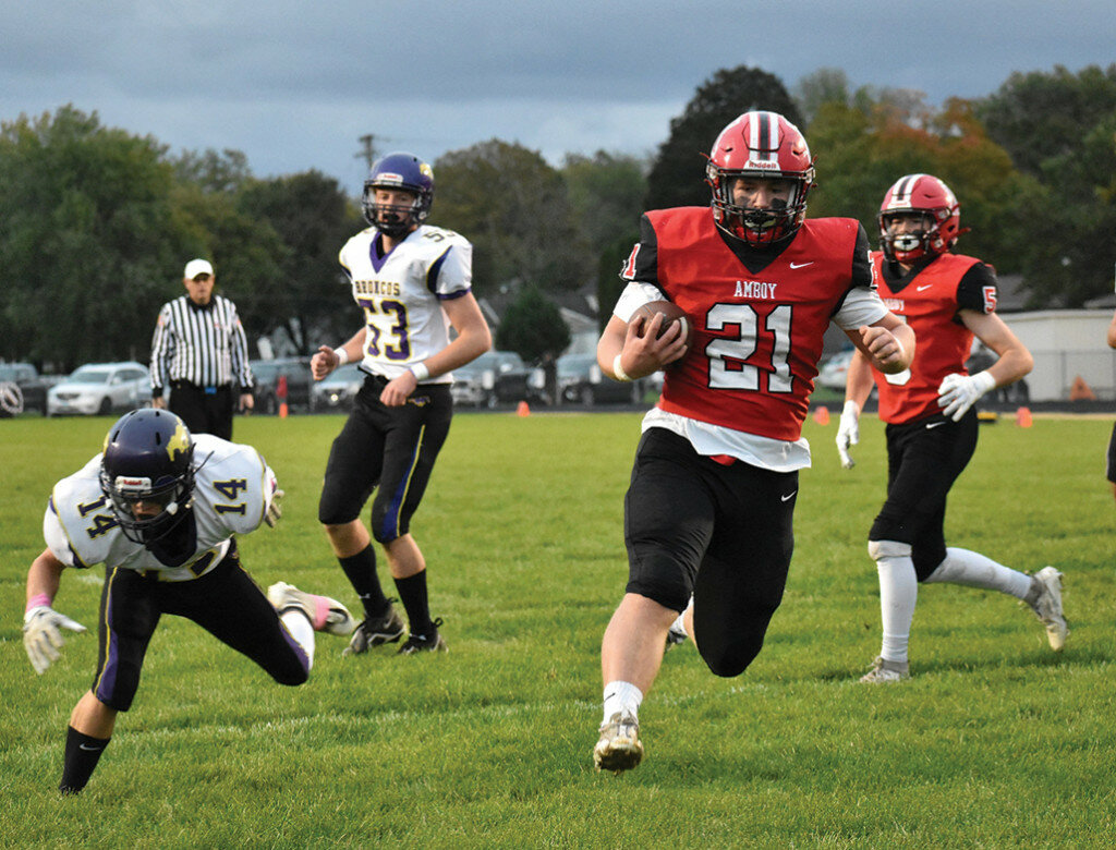 Amboy junior Quinn Leffelman, top photo No. 21, runs the ball against Orangeville in the Clippers’ 72-12 Week 8 victory in Amboy. Leffelman recorded 12 carries for 81 yards and three touchdowns. (Photos courtesy of Brenda Merriman)