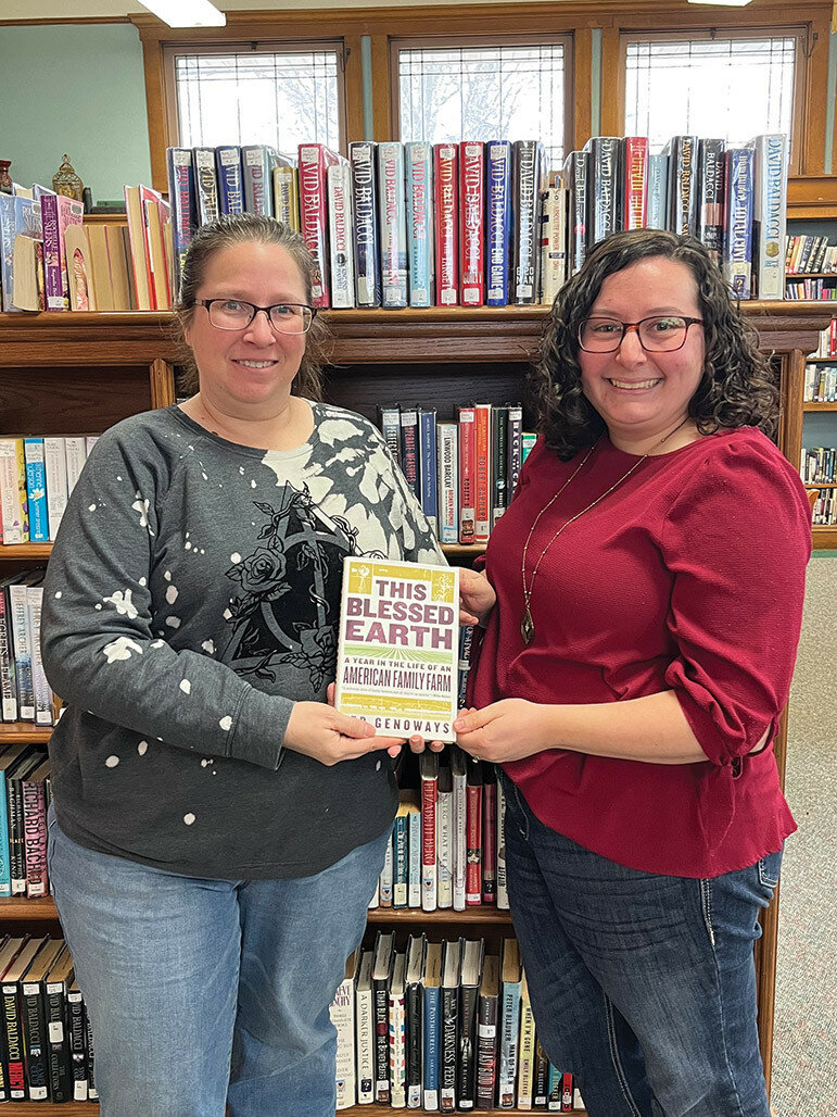 Pictured right, in honor of National Ag Day, recognized March 21, the Lee County Farm Bureau Young Leader Committee donated “This Blessed Earth:  A Year in the Life of An American Family Farm” written by Ted Genoways to five public libraries in Lee County.  Josie Willett (right) of the LCFB make the donation to the Pankhurst Memorial Library in Amboy. 
Photo submittedPictured right, in honor of National Ag Day, recognized March 21, the Lee County Farm Bureau Young Leader Committee donated “This Blessed Earth:  A Year in the Life of An American Family Farm” written by Ted Genoways to five public libraries in Lee County.  Josie Willett (right) of the LCFB make the donation to the Pankhurst Memorial Library in Amboy. 
Photo submitted
