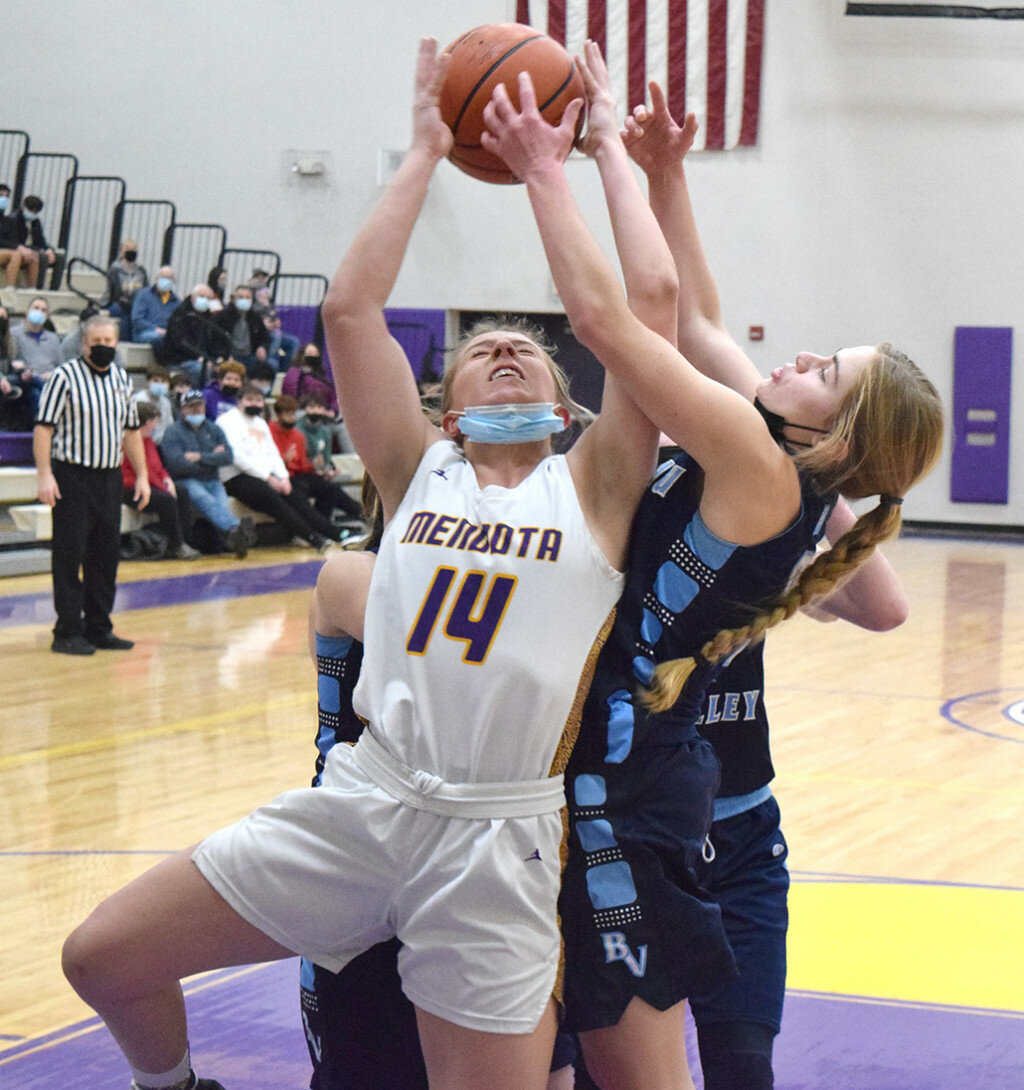 Mendota’s Paige Manning battles for a rebound with Alaina Wasilewski of Bureau Valley on Feb. 5 at the MHS gym. (Reporter photo)