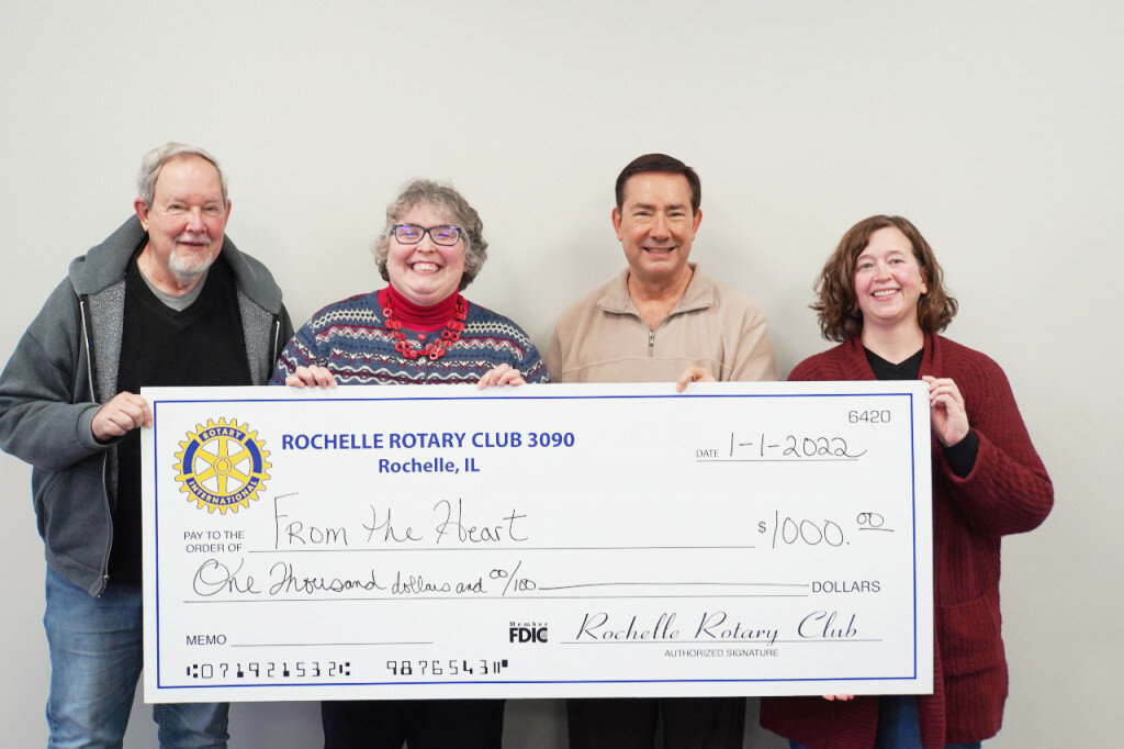 Left to right: Chuck Watkins, treasurer of Rochelle Rotary Club and Sarah Flanagan, president of the Rochelle Rotary Club, present a check for $1,000 to David Eckhardt, president of the From The Heart organization and Tonja Greenfield, secretary of the From The Heart Organization.