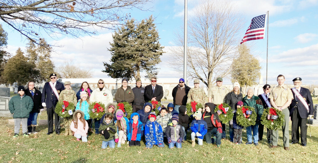 Members of the Girl & Boy Scouts, American Legion, VFW, Knights of Columbus, National Guard and the community assisted the Rochelle Chapter Daughters of the American Revolution in honoring veterans through ceremonies at four local cemeteries, followed by placing wreaths at veterans' graves.