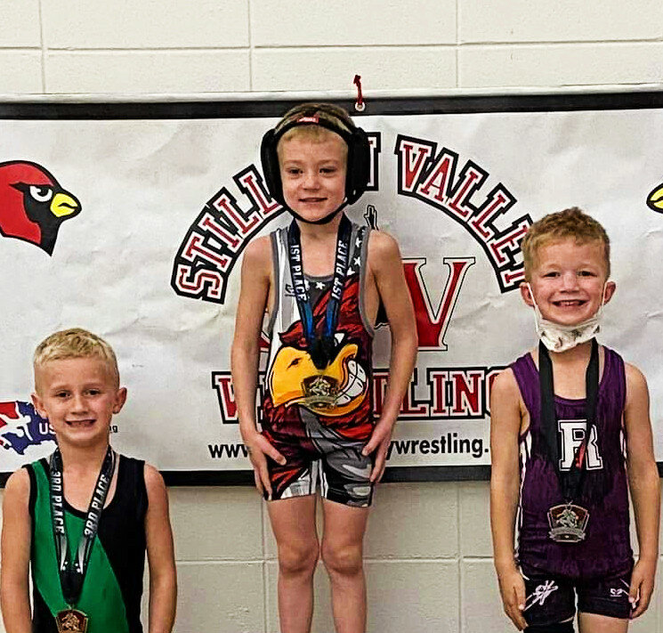 The Rochelle Wrestling Club competed at the Stillman Valley Holiday Tournament on Sunday, with several athletes earning medals including Wells Millard (right). (Courtesy photo)
