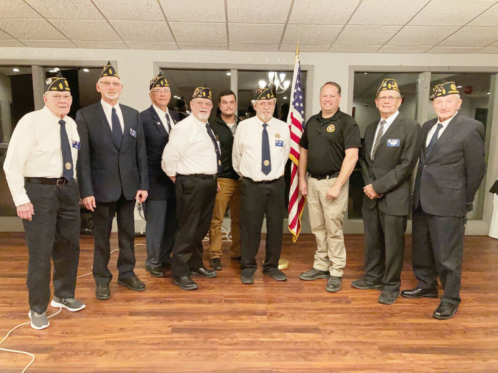 From left to right: Tom Hill (sargent at arms), Eric Wells (finance officer),  Steve Korth (adjutant), Paul Bearrows (chaplain), Cole Albers (junior vice-commander), John Gruben (commander), Ogle County Sheriff Brian VanVickle, Chuck Roberts (senior vice-commander) and Gary Tarvestad (past commander).