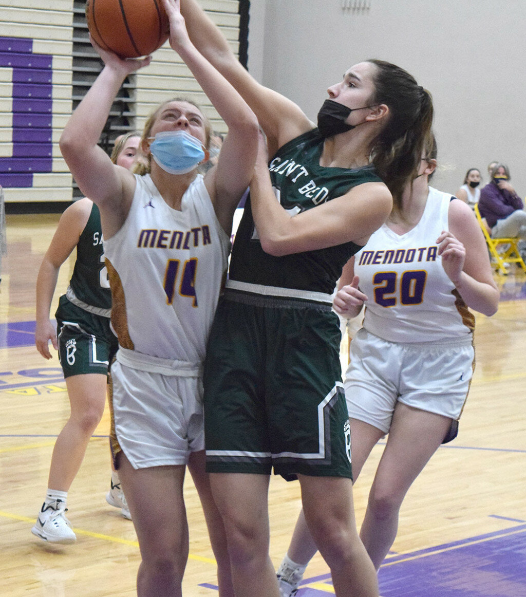 Mendota’s Paige Manning has her shot contested by Lia Bosnich of St. Bede during a Three Rivers Conference varsity basketball contest on Dec. 2 at the MHS gym. (Reporter photo)