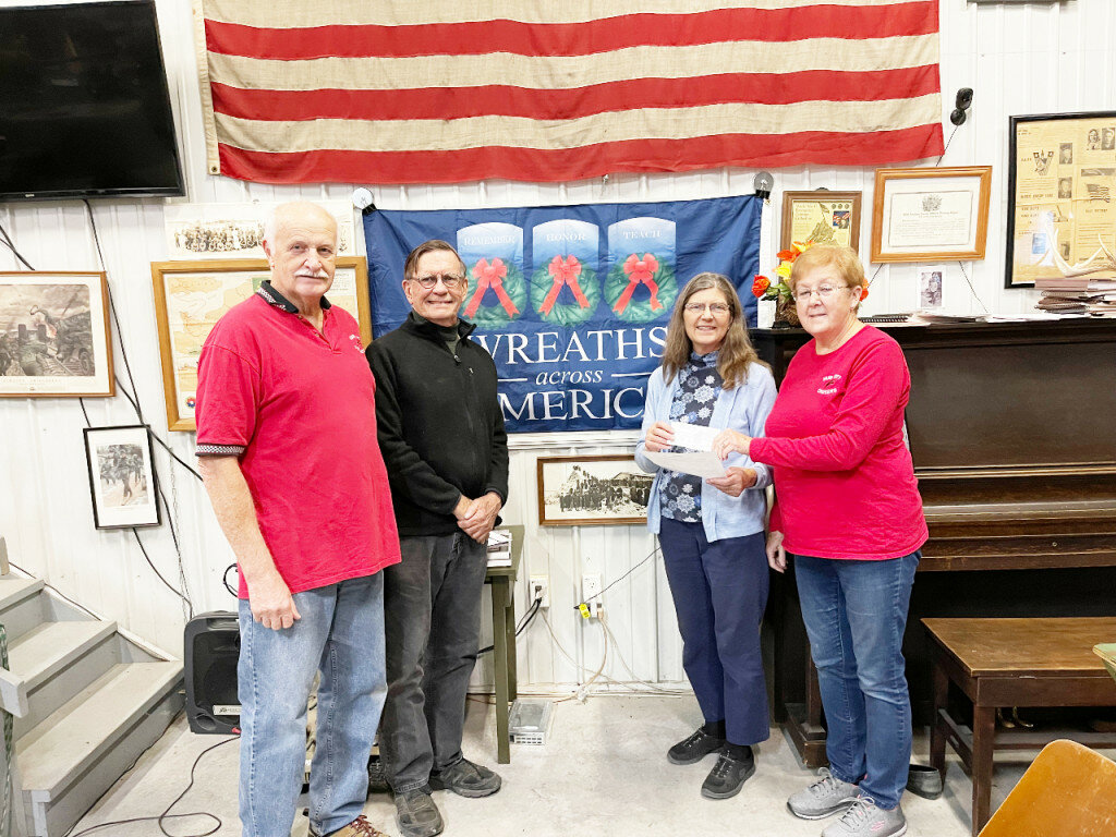 From left to right are Tom Van Hise, Chuck Roberts, Lydia Roberts (coordinator of Wreaths Across America in Rochelle) and Paula Combs (treasurer, Hub Cruisers).