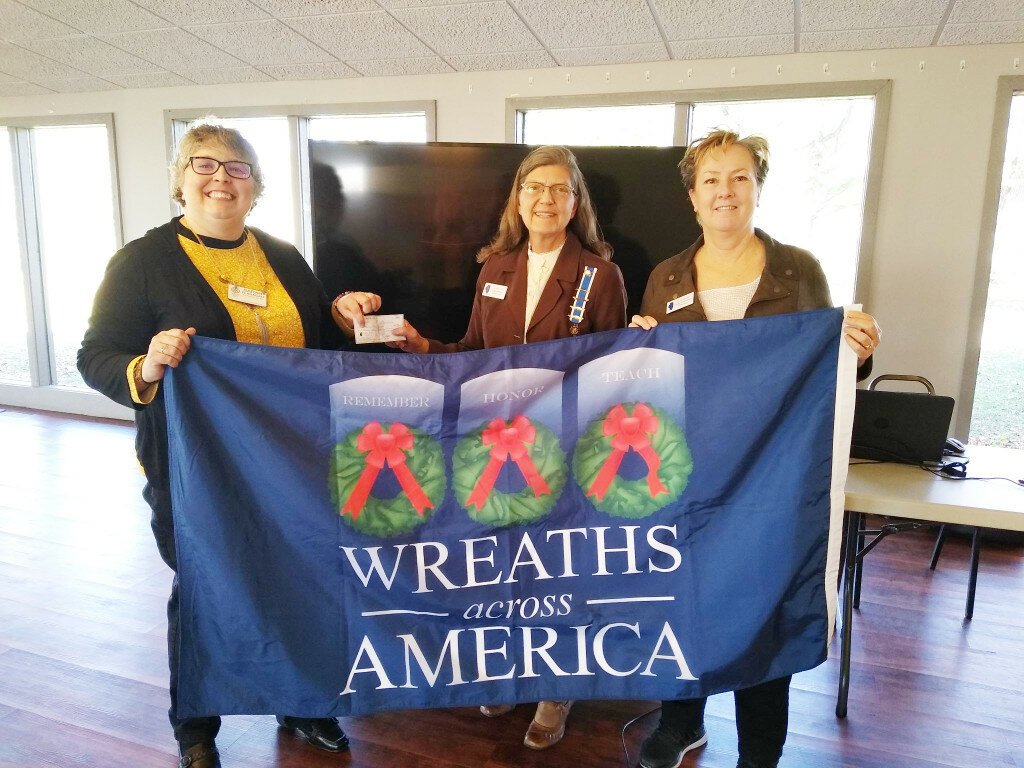 Pictured are Sarah Flanagan, Rotary president, Lydia Roberts, Wreaths Across America chair and Regent Laurie Perry.