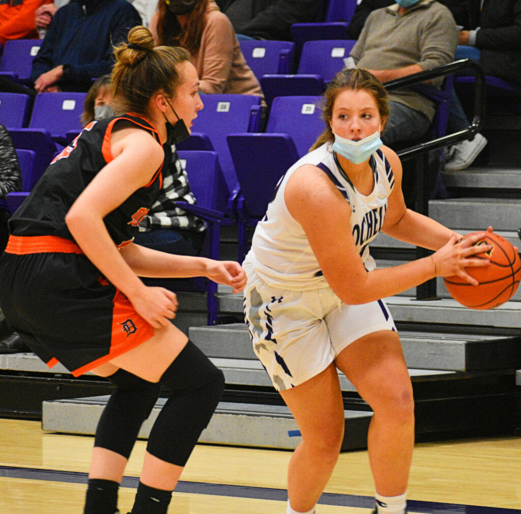 Freshman Kendyl Darby drives against DeKalb's Kailey Porter during the Rochelle Lady Hub varsity basketball game against the Barbs on Monday. (Photo by Russell Hodges)