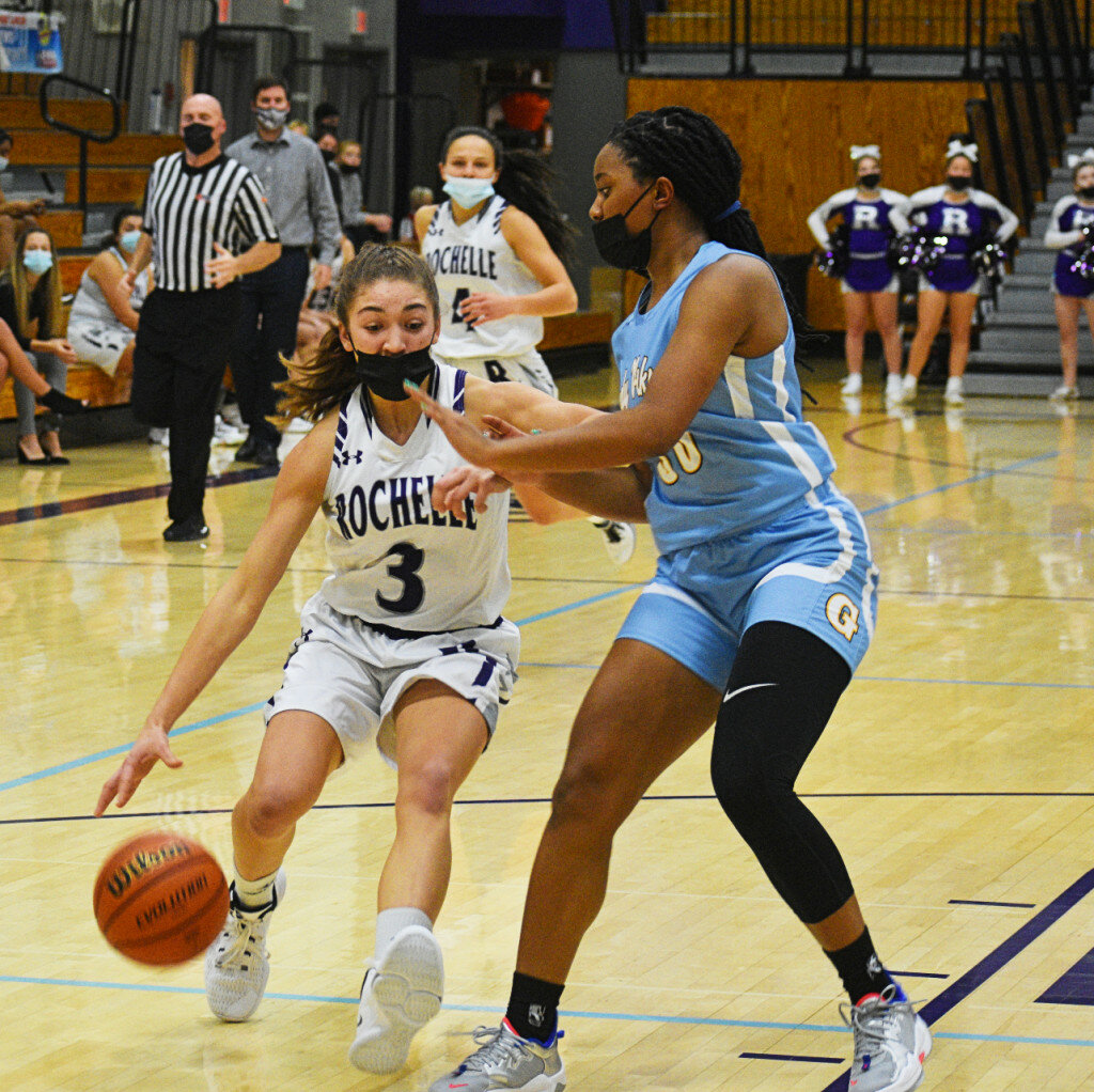 Sophomore Alivia Henkel drives against Rockford Guilford’s Sydney Donaldson during the Rochelle Lady Hub varsity basketball game on Tuesday. (Photo by Russell Hodges)