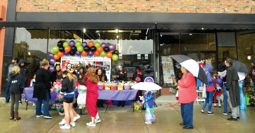 Gordon Woods / Journal — Rain didn’t stop kids and parents from enjoying annual Halloween activities last week.  The Vault was one of the locations on Mr. Lincoln’s Square to host trick or treaters on Oct. 29. See more photos on page A3 of the Journal print and E-Editions.