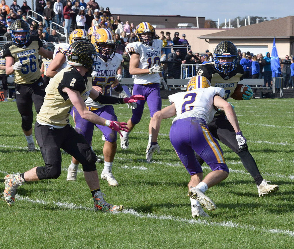 Mendota’s Isaac Smith (No. 2) closes in on Pecatonica running back Trenton Taylor during a first-round playoff game on Oct. 30 at Pecatonica. (Reporter photo)