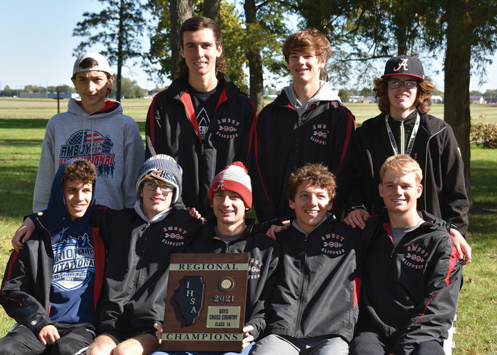 The Amboy boys cross country team holds up the Regional Championship Plaque. The team competed at the St. Bede Class 1A Regional on Oct. 23 and finished in first place in the team competition.
Photo courtesy of Heather Loftus