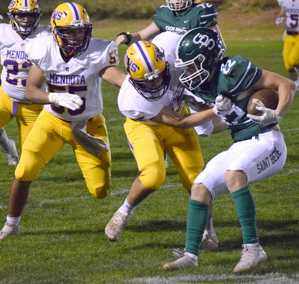 Mendota’s Abel Rodriguez gets a handful of Luke Story’s jersey in an attempt to bring the St. Bede runner down on Oct. 21 at Peru. (Reporter photo)