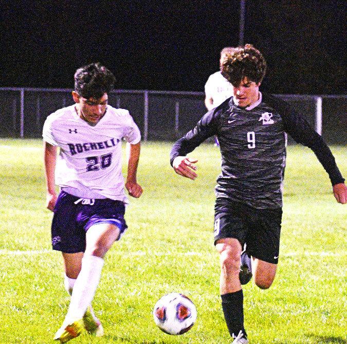 Freshman Alberto Casillas races for the ball during the Rochelle Hub varsity soccer match against Kaneland on Wednesday. (Photo by Russell Hodges)