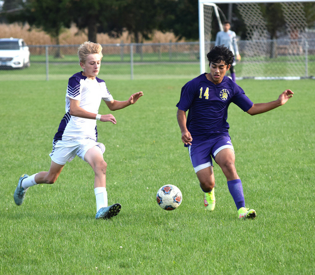 Mendota’s Luis Garcia, right, is in a footrace to the ball with Serena’s Carson Baker in the regional championship soccer game on Oct. 15 at Serena. (Reporter photo)