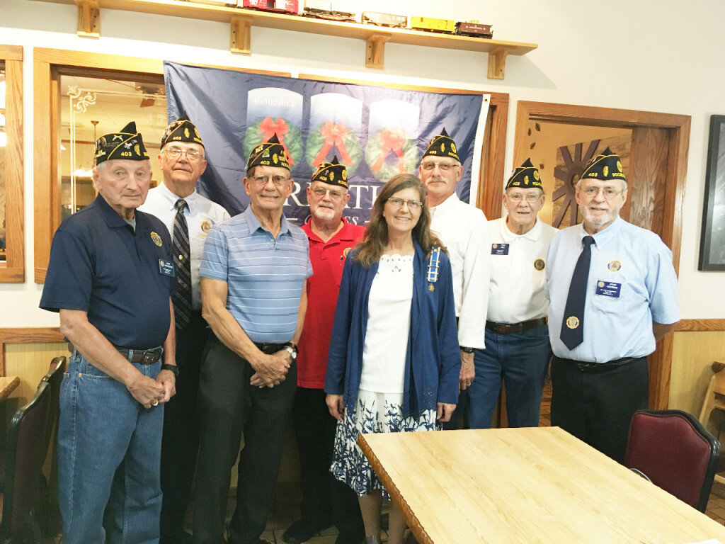 Pictured from left to right: Gary Tarvestad (past commander), Steve Korth (co-adjutant), Chuck Roberts (senior-vice commander), Paul Bearrows (chaplain), Lydia Roberts (Daughters of the American Revolution), Eric Welles (finance officer), Tom Hill (sargent at arms) and  John Gruben (commander).