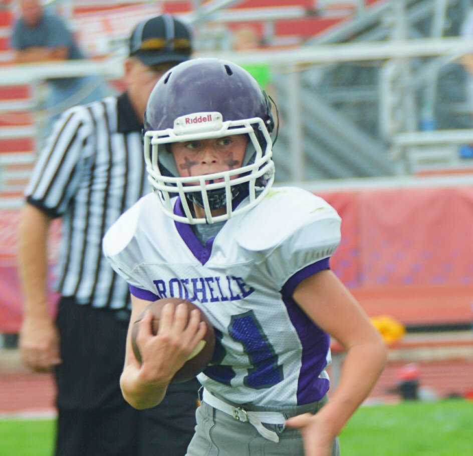 Caden Goodwin carries the ball for the Rochelle Junior Tackle eighth-grade football team on Saturday. (Photos by Robin Rethwill)