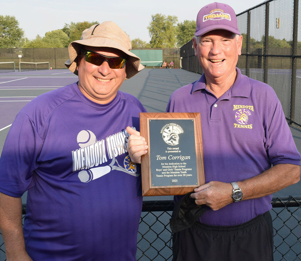 Tom Corrigan, right, is congratulated by MHS tennis coach Shawn LeRette upon Corrigan’s retirement from the coaching staff after more than 35 years. (Reporter photo)
