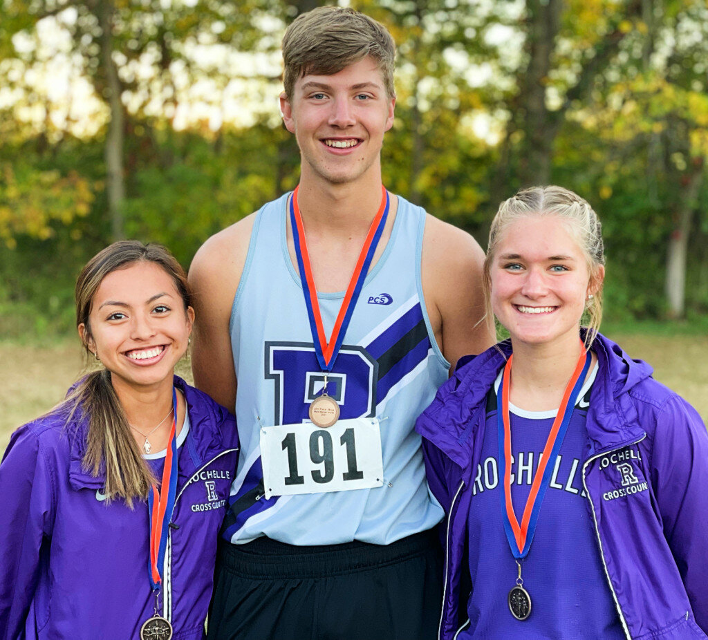 Rochelle cross country runners Yuelma Ortiz, David Wanner and Sara Johnson (left to right) earned medals at Genoa-Kingston’s Matt Walter Invitational on Tuesday. (Courtesy photo)