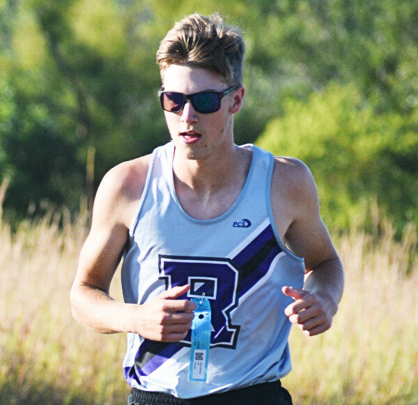 Junior David Wanner pushes through the course at Skare Park during the Rochelle Invitational on Thursday. (Photo by Russell Hodges)