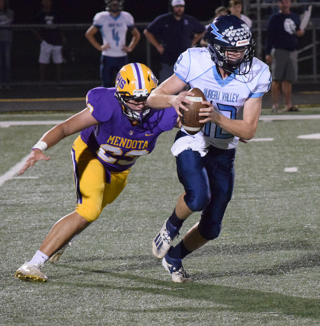 Mendota's John Gonzalez is on his way to running down Bureau Valley quarterback Adam Johnson for a sack on Sept. 10 at the MHS field. (Reporter photo)