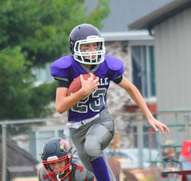 Van Gerber carries the ball for the Rochelle Junior Tackle eighth-grade football team against Stillman Valley on Saturday. (Photos by Robin Rethwill)