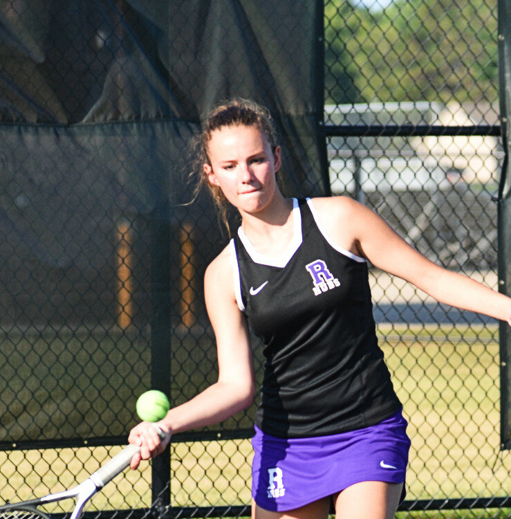 Senior Emma Hicks goes to her forehand during the Rochelle Lady Hub varsity tennis team's match against DeKalb on Wednesday. (Photo by Russell Hodges)