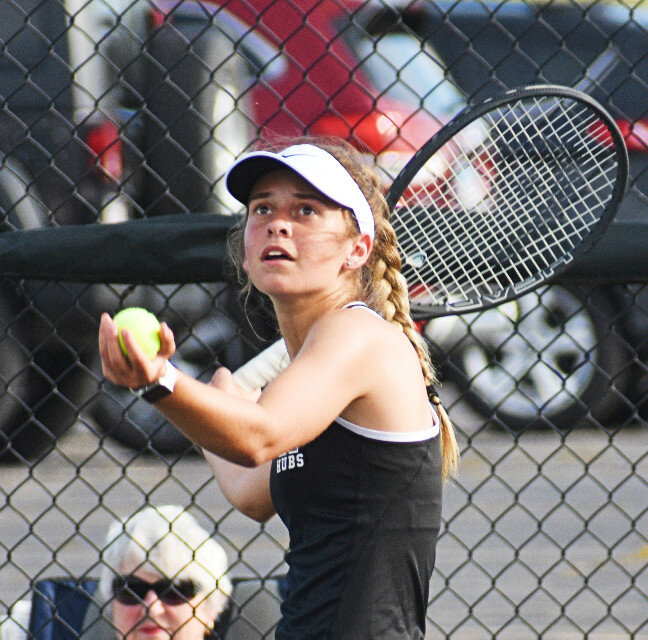 Senior MeLisa Young prepares to serve during the Rochelle Lady Hub varsity tennis team's match against Rockford Lutheran on Tuesday. (Photo by Russell Hodges)