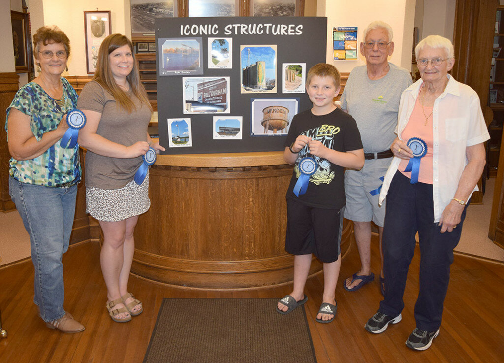 Winners in the “Capturing Our Town” photography contest, left to right, are Donnetta Holtz, Michelle Piller, Trevor Lengsfeld, Kirby Hayward and Ruth Dunlap. Winners not pictured: Beth Stratton, Gerry Holtz. (Reporter photo)