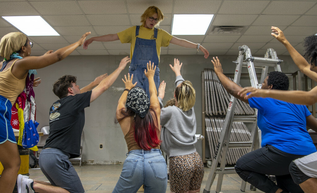 Cast members rehearse for '70s rock musical "Godspell"