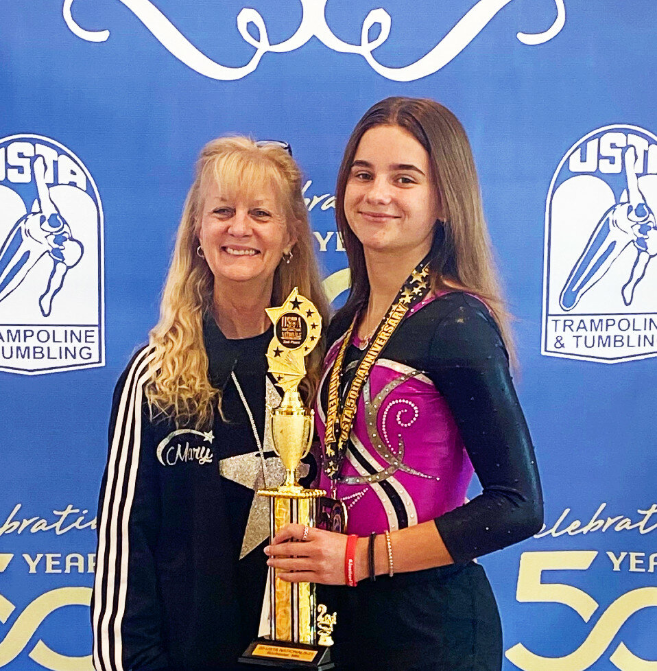 Rochelle tumbler Alexandra Neece finished second in the 13-14 Intermediate Girls Division during the 2021 USTA Nationals in Rochester, Minnesota this past month. Neece is pictured above with her coach, Mary Wright. (Courtesy photo)