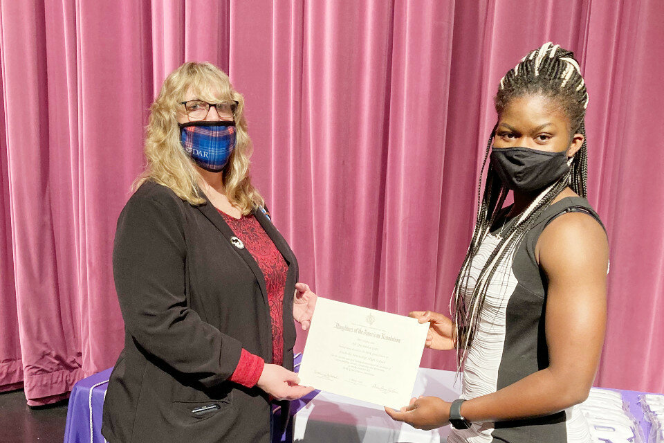 Rochelle Chapter Treasurer Becky Danner (left) presented the award to RTHS grad Afi Gati, who plans to attend Augustana College and major in a pre-med curriculum.