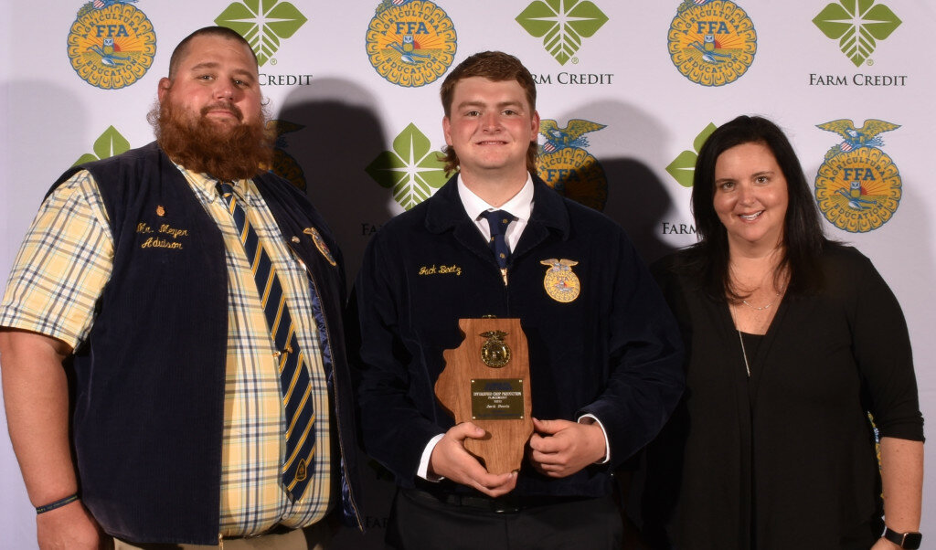 Jack Beetz, center, is congratulated by Matthew Meyer, Agriculture Teacher/FFA Advisor, left, and Brooke Beetz, Jack’s mother. (Photo contributed)
