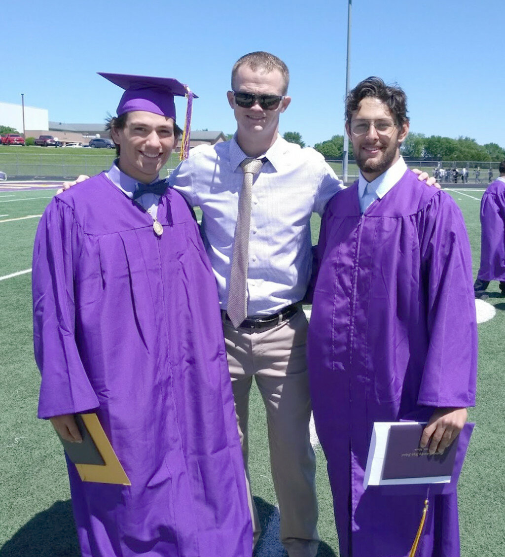 MHS teacher/coach Keegan Hill congratulates Derek Nanez, left, and Andres Castaneda after their graduation from Mendota High School in May. Both played football for Hill in the MHS program. (Photo contributed)
