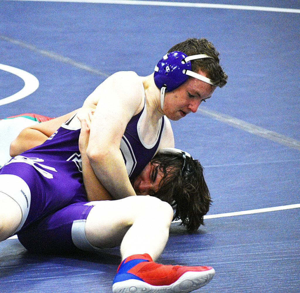 Sophomore Troy Papke nearly pins LaSalle-Peru's Gage Swiskoski during the Rochelle Hub varsity wrestling meet against the Cavaliers on Wednesday. (Photo by Russell Hodges)