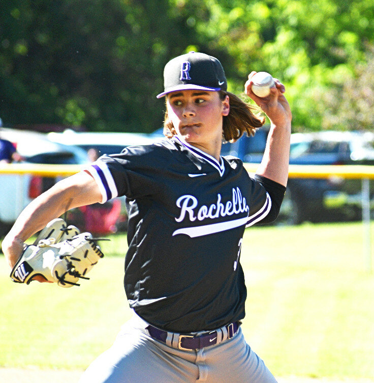Junior Braden Alfano fires a pitch off the mound during the Rochelle Hub varsity baseball game against Dixon on Friday. (Photo by Russell Hodges)