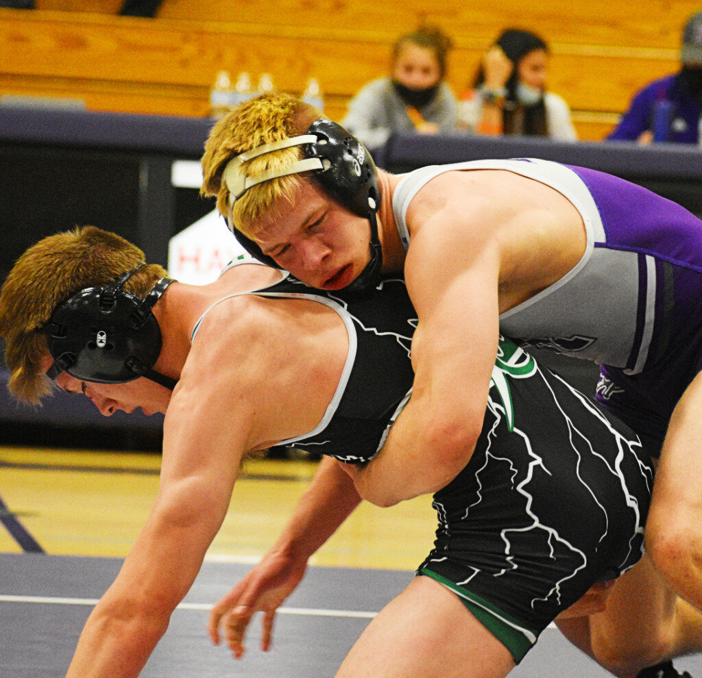 Junior Caleb Nadig controls West Carroll's Ethen Doty during the Rochelle Hub varsity wrestling meet against the Thunder on Tuesday. (Photo by Russell Hodges)