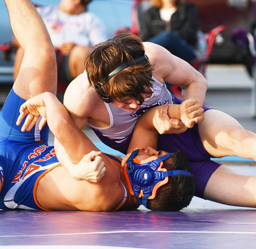 Sophomore Weldon Nay nearly pins Genoa-Kingston's Joan Moreno during the Rochelle Hub varsity wrestling match against the Cogs and Rockford East on Wednesday. (Photo by Russell Hodges)