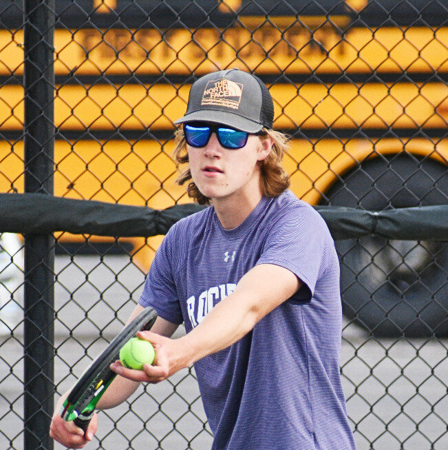 Sophomore David Wanner prepares to serve for the Rochelle Hub varsity tennis team. (Photo by Russell Hodges)