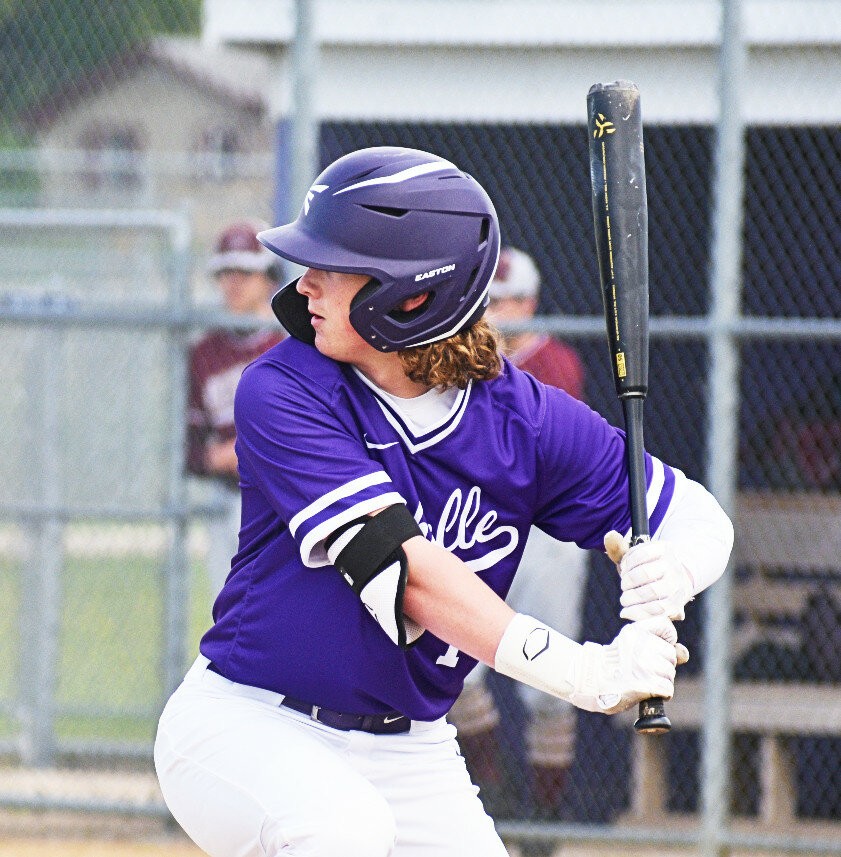 Junior Nate Burdin loads up in the box for the Rochelle Hub varsity baseball team. (Photo by Russell Hodges)