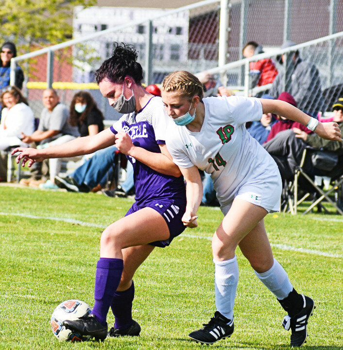 Sophomore Kyra Rimstidt battles for possession during the Rochelle Lady Hub varsity soccer game against LaSalle-Peru on Monday. (Photo by Russell Hodges)