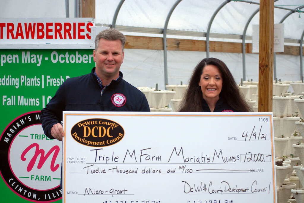 Courtesy of DCDC — 
Triple M Farm owners Greg and Mariah Anderson have been providing central Illinois residents fresh vegetables and mums since 2009. Funds provided by the DCDC microgrant will allow the couple to fast-track infrastructure expansion of their vertically-grown strawberries, extending their season into early fall.